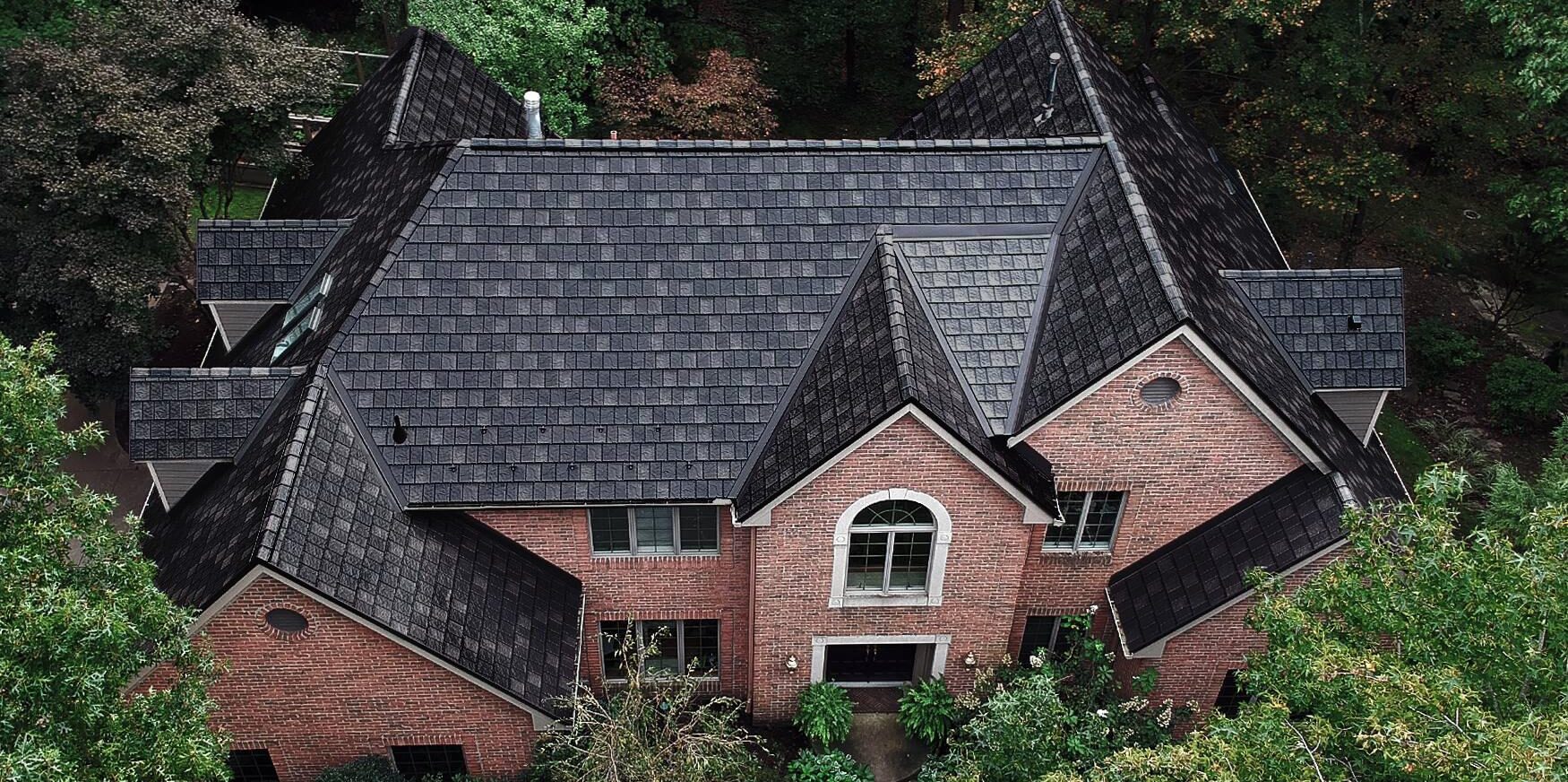 Beautiful brick home with premium metal shingle roofing — durable, energy-efficient, and built to last.