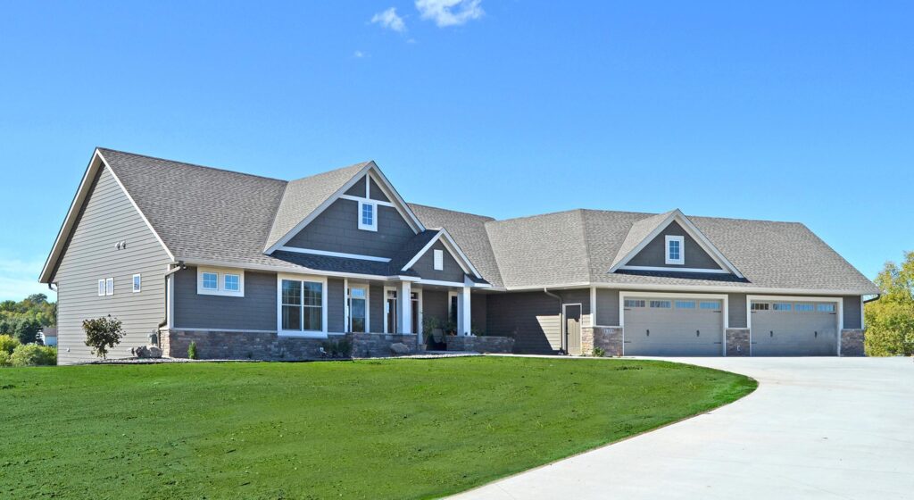 EDCO's steel Single 6" Traditional Lap Siding in T-Tone transforms this home with sophisticated gray tones and clean architectural lines.