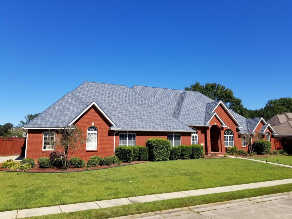 Brick home featuring EDCO Granite steel shingles.